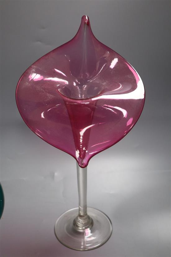 A ruby Jack in the Pulpit glass vase, height 32cm and a pair of green glass scrolls